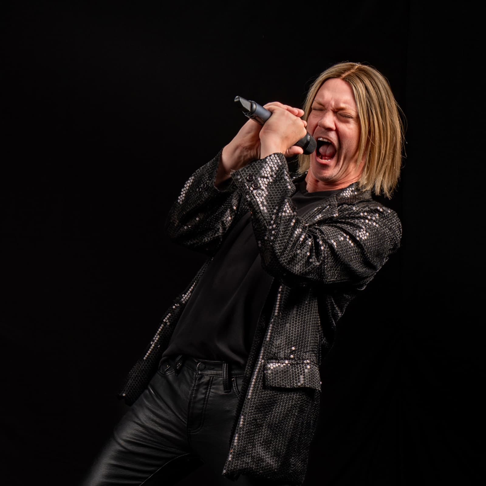 Justin Whitehead, performing as Joe Elliott